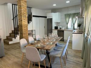 a dining room with a table with wine glasses on it at CAN´SELMA 1 in Chella