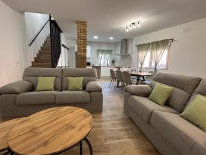 a living room with two couches and a table at CAN´SELMA 1 in Chella