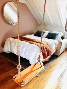 a swing in a bedroom with a bed at Lovely flat 20min from Champs Élysée, 10min from Stade de France in Saint-Denis