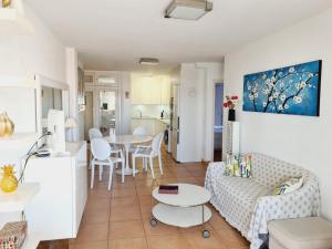 a living room with a couch and a table at Casa Puerto Maritimo in Corralejo