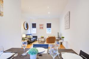 A restaurant or other place to eat at Beautiful Two Bedroom Apartment with Free Parking!