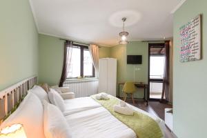 Postel nebo postele na pokoji v ubytování Villa Kaja Bansko