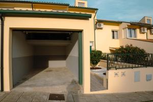a garage with the door open in a building at Casa do Carriço in Peso da Régua