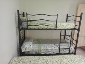 two bunk beds in a room next to a wall at Apartamento en Vinaros in Vinarós