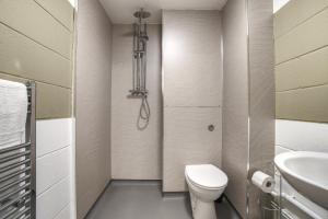 a bathroom with a toilet and a sink at #10 Phoenix Court By DerBnB, Industrial Chic 1 Bedroom Apartment, Wi-Fi, Netflix & Within Walking Distance Of The City Centre in Sheffield