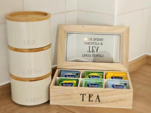 a wooden box filled with different types of tea at Eaglegate in Colchester