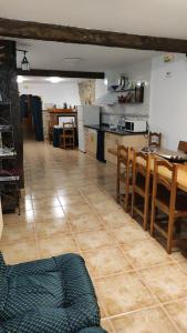 a kitchen and dining room with a table and chairs at Casa Jacobea in Grañón +18 photos