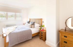 a bedroom with a bed and a window at Rousdon Mist in Rousdon