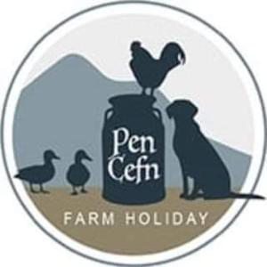 a logo for a farm holiday with birds sitting on a can at Cwtch Winnie Shepherd's Hut- Pen Cefn Farm Holiday in Abergele
