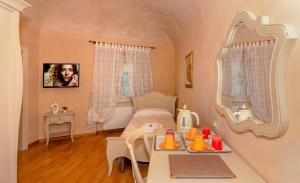 En eller flere senge i et værelse på Residenza d'Epoca Relais I Miracoli
