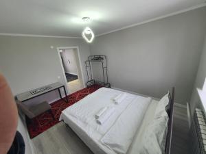 Guest House « Terrabella » tesisinde bir odada yatak veya yataklar
