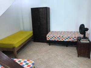 Łóżko lub łóżka w pokoju w obiekcie Carnaval Inn Salvador