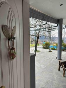 a door with a view of a patio at Chouliarades Tzoumerka in Chouliarades