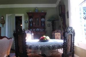 a dining room with a table and chairs with a bowl of fruit at Mulberry Lavender Farm and B&B in Mulberry