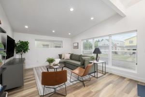 a living room with a couch and two tables at Renovated 2BR 1BA Flat Walkable to 25th Street in Ogden