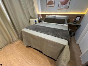 En eller flere senge i et værelse på Studio Paris prox Metro Bras Feirinha Madrugada Templo Salomão