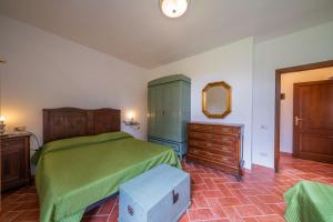Säng eller sängar i ett rum på Podere Il Ghiaccio by Agriturismo Casetta