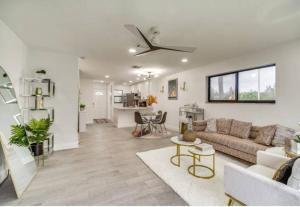a living room with a couch and a table at Beach getaway paradise in Fort Pierce