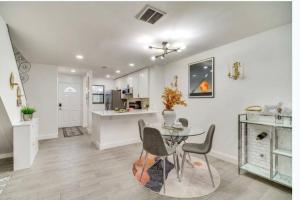 a kitchen and dining room with a table and chairs at Beach getaway paradise in Fort Pierce