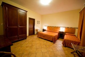 Posteľ alebo postele v izbe v ubytovaní Baglio Cudia Resort