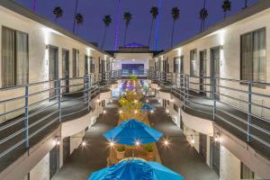 arium of a building with blue umbrellas at Comfort Inn Santa Monica - West Los Angeles in Los Angeles