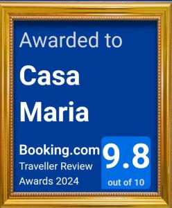 a framed sign for aza marina in a gold frame at Casa Maria in Agulo