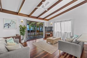 a living room with a couch and a table at Sailor's Lookout in Airlie Beach
