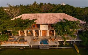 an aerial view of a house on the water at C Beyond Nilaveli in Nilaveli