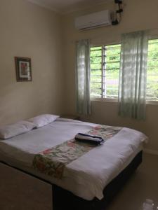 Postel nebo postele na pokoji v ubytování New Mavida Lodge
