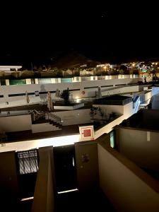 a view of a building at night with lights at Tenerife Holidays in Adeje