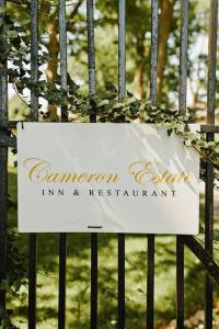 a sign on a gate with a sign on it at Cameron Estate Inn in Mount Joy