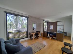 a living room with a couch and a table at Modern loft, view-town-La Candelaria neighborhood in Bogotá