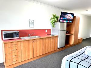 Kuchyň nebo kuchyňský kout v ubytování Mackay Resort Motel