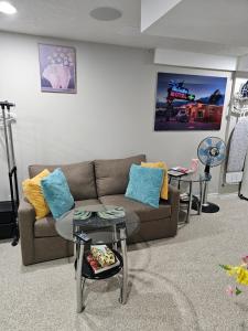 a living room with a couch and a table at Amazing cozy fully private studio in London