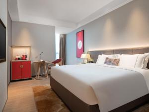 Letto o letti in una camera di Echeng Hotel - Huawei Base Store in Shenzhen