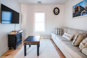 a living room with a couch and a table at Very Cozy, 2 Bedroom Farmhouse Apartment 2nd FL in Lancaster