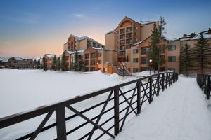 a bridge in the snow in front of condos at Marriott's Mountain Valley Lodge at Breckenridge in Breckenridge
