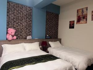 Ein Bett oder Betten in einem Zimmer der Unterkunft Happy Life B&B