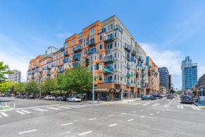 a large building on a city street with an intersection at Seattle Among The Trees: in Belltown w/Parking! in Seattle