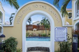 an archway leading to the pool at a resort at Waterfront 2-bed townhouse - Harbour 17 townhouse in Gros Islet