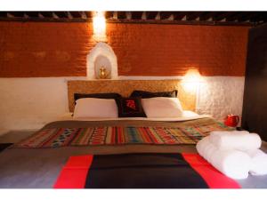 Letto o letti in una camera di Hira Guest House