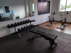 a gym with several exercise bikes in a room at Fun-Ocean-Chill in Negombo