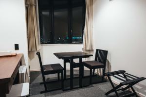 a table and two chairs in a room with a window at TAPSTAY HOTEL - Vacation STAY 35228v in Saga