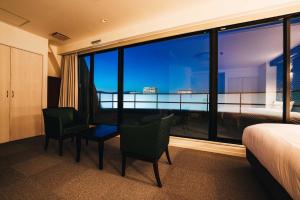 a hotel room with a bed and a view of the city at TAPSTAY HOTEL - Vacation STAY 35227v in Saga