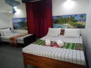 Кровать или кровати в номере Erandi Holiday Home
