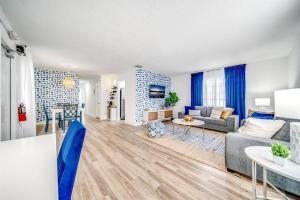 a living room with a couch and a table at Adorable Condo in Peaceful Area - Palm Wave Says in Coconut Creek