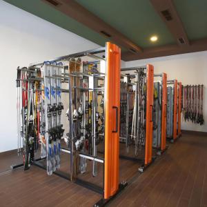 a bunch of skis are lined up in a room at BH and Semiramida Ski Apartment in Borovets