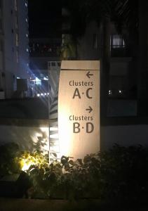 a sign that reads clusters a c clusters bd at Condo Palm Tree 1 Across NAIA T3 in Manila