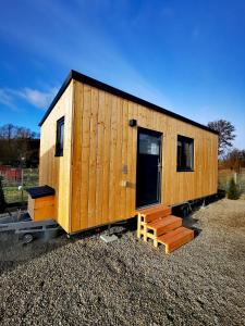 a tiny house sitting on a gravel lot at Landhaus Herdt in Lauda-Königshofen