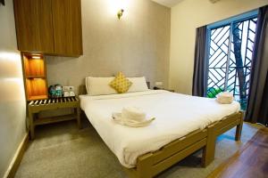 Postel nebo postele na pokoji v ubytování Hotel Bela Goa